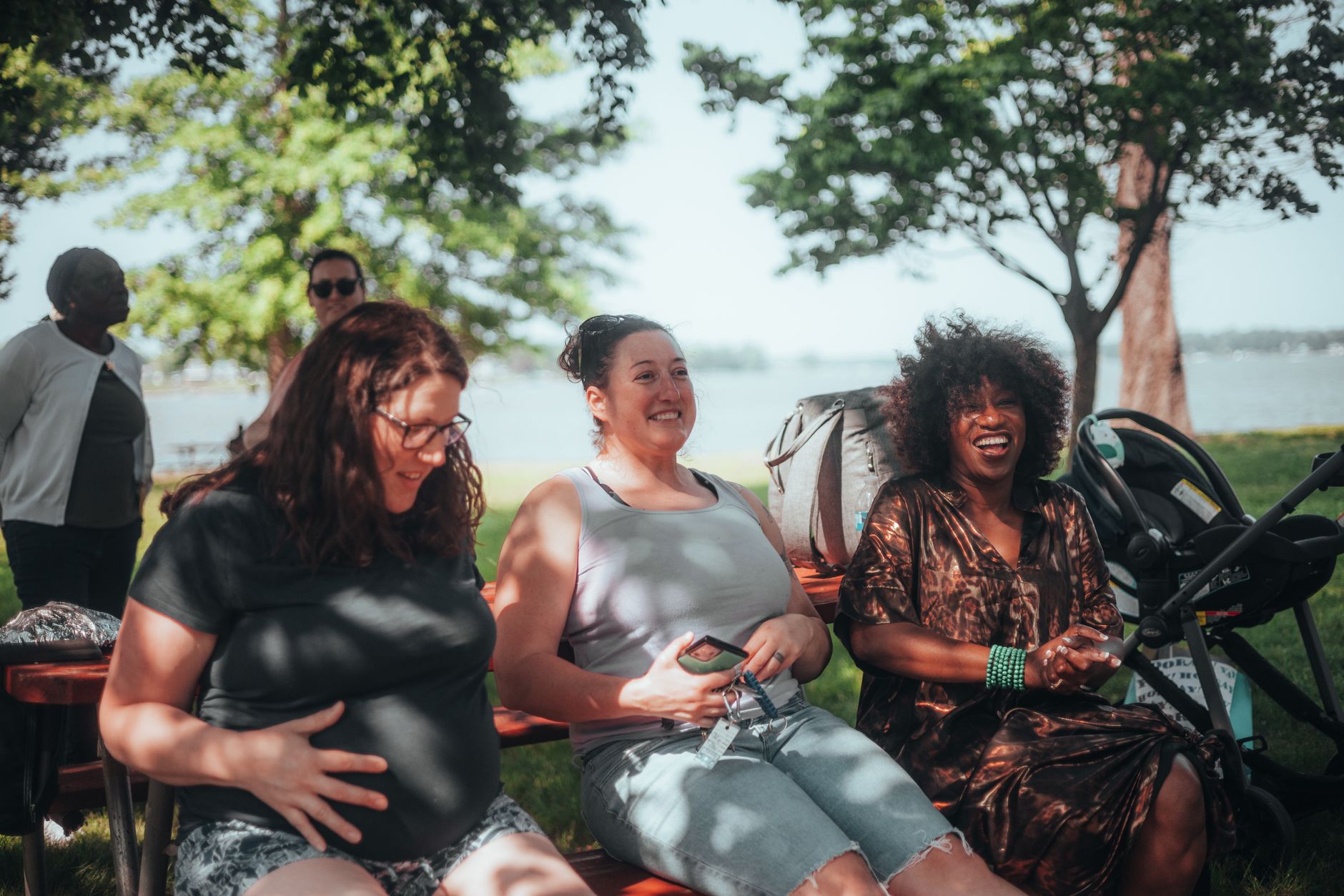 Group of moms laughing at park