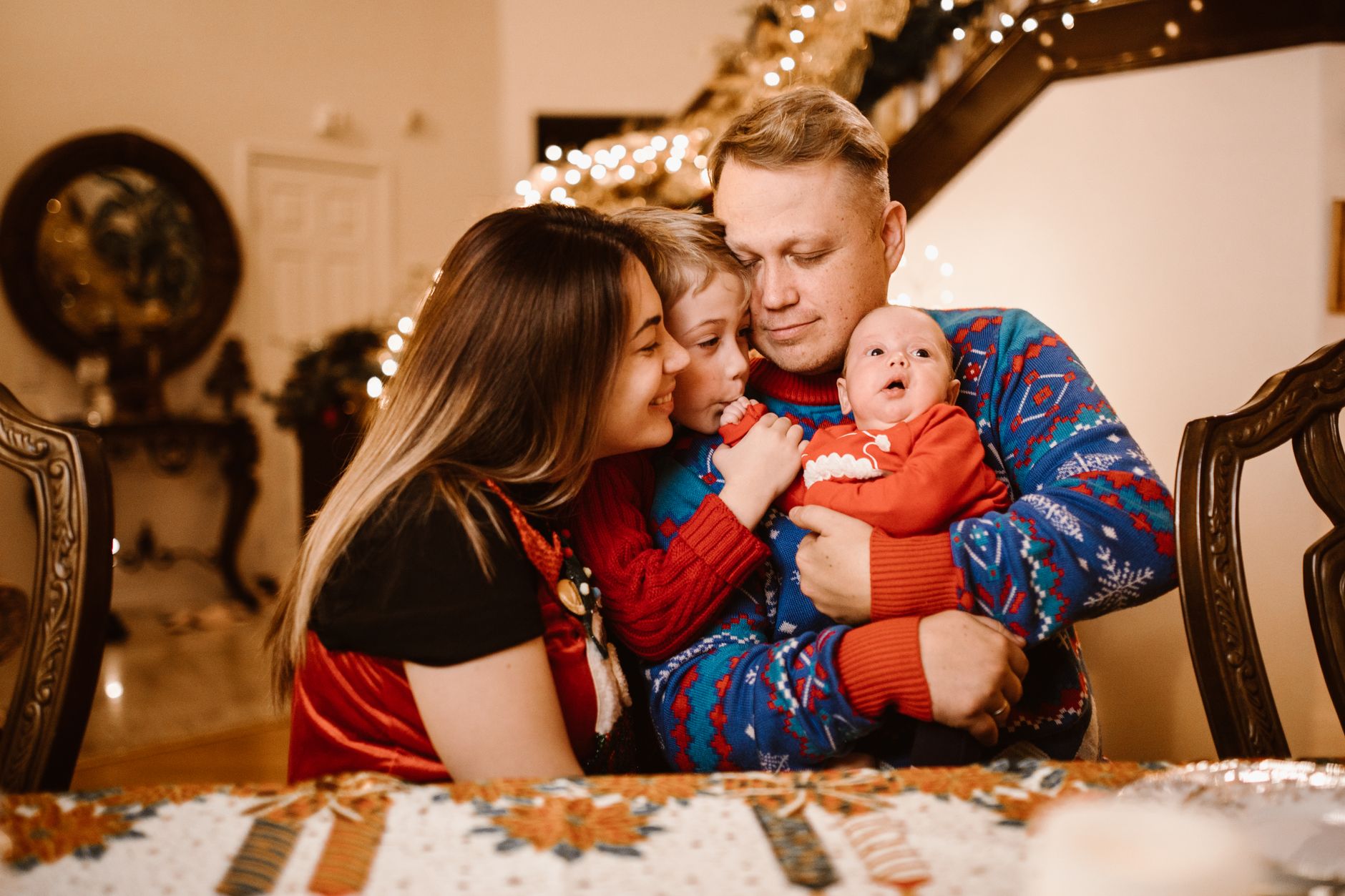 Family with newborn and health screening checklist