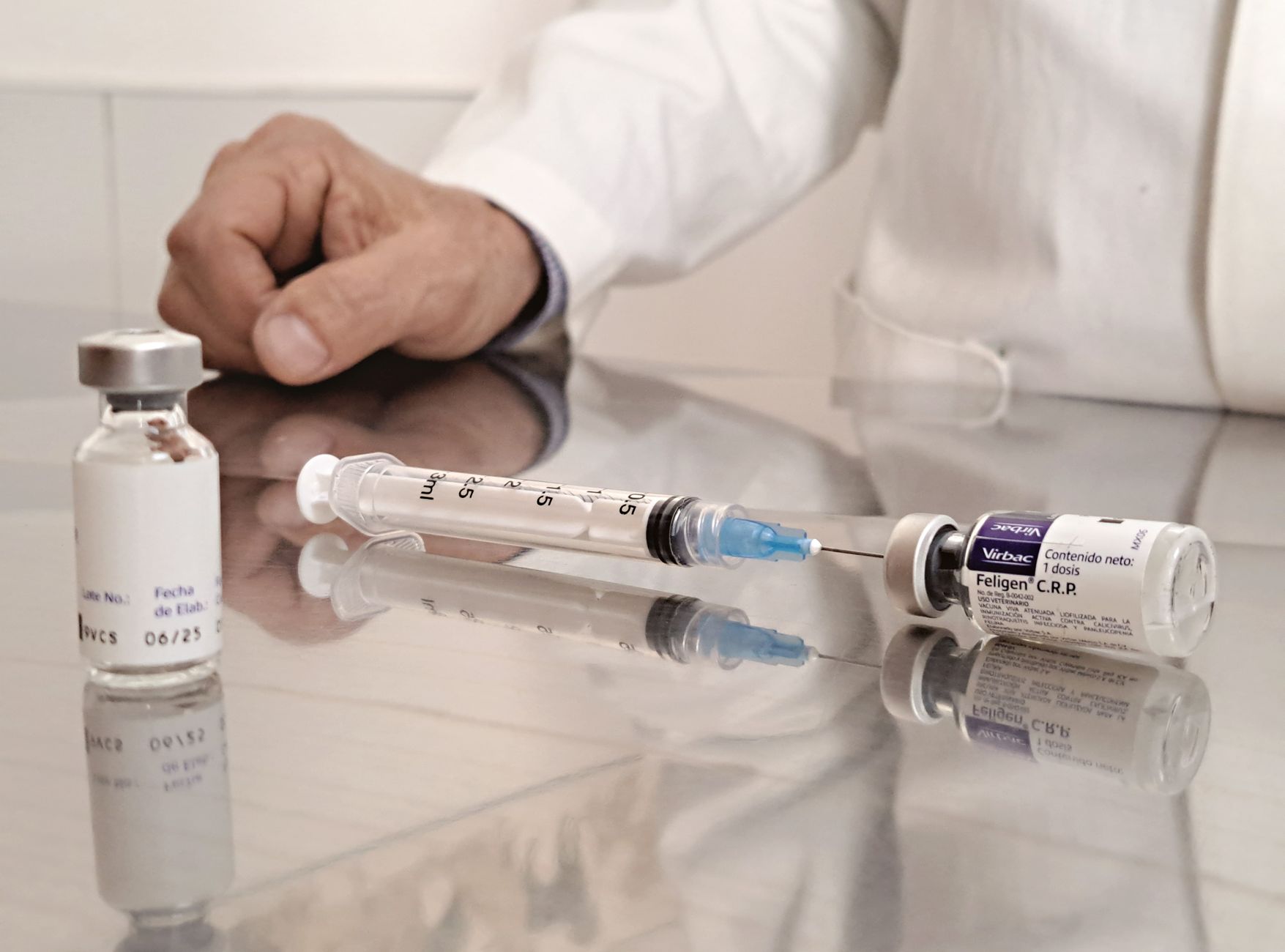 A close‑up of a pediatrician’s hand holding a vaccine vial beside a baby’s hand, soft natural lighting, clinical setting with gentle colors