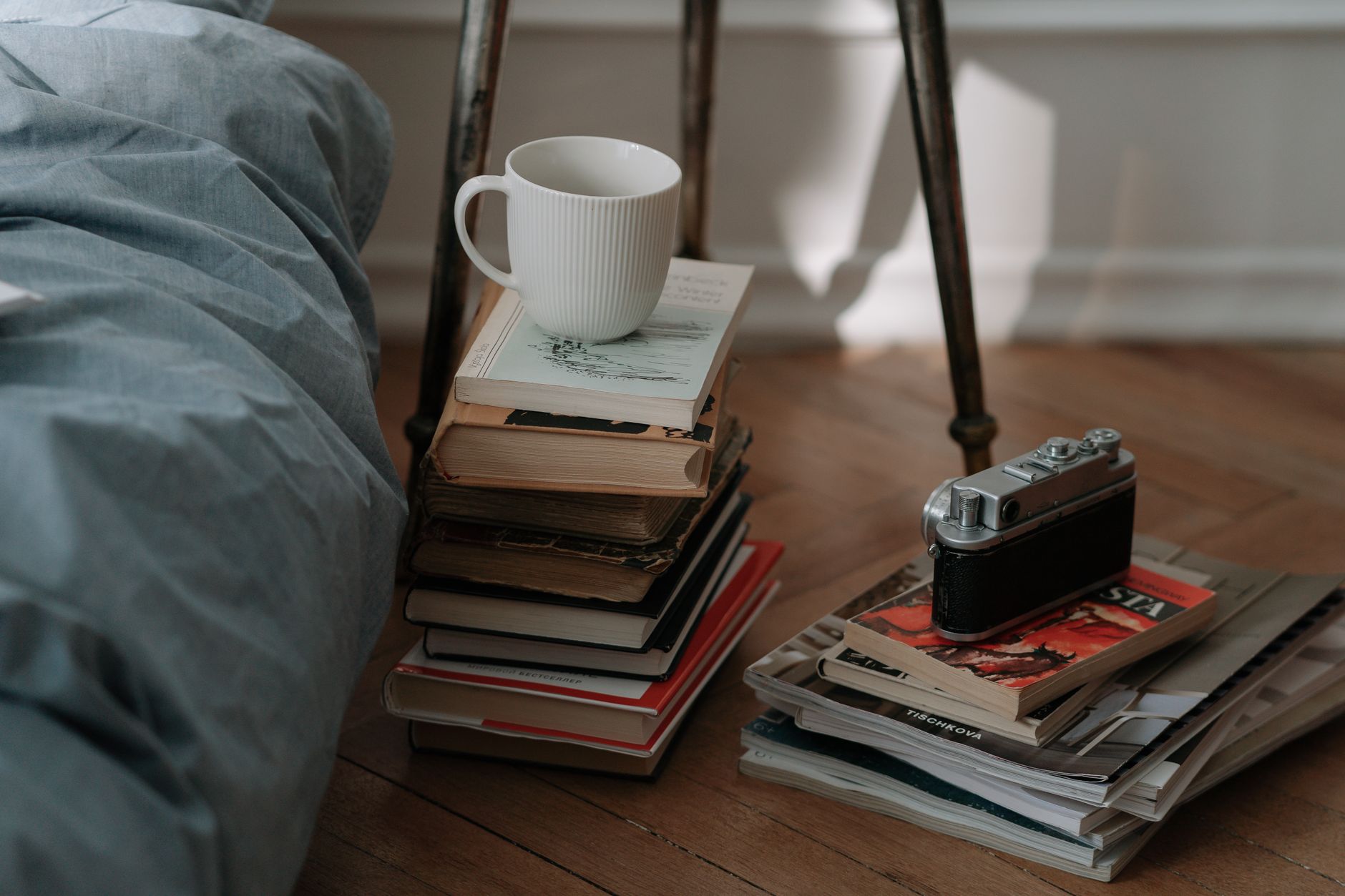 A quiet corner with a reading chair, warm lighting, and a mug of tea.