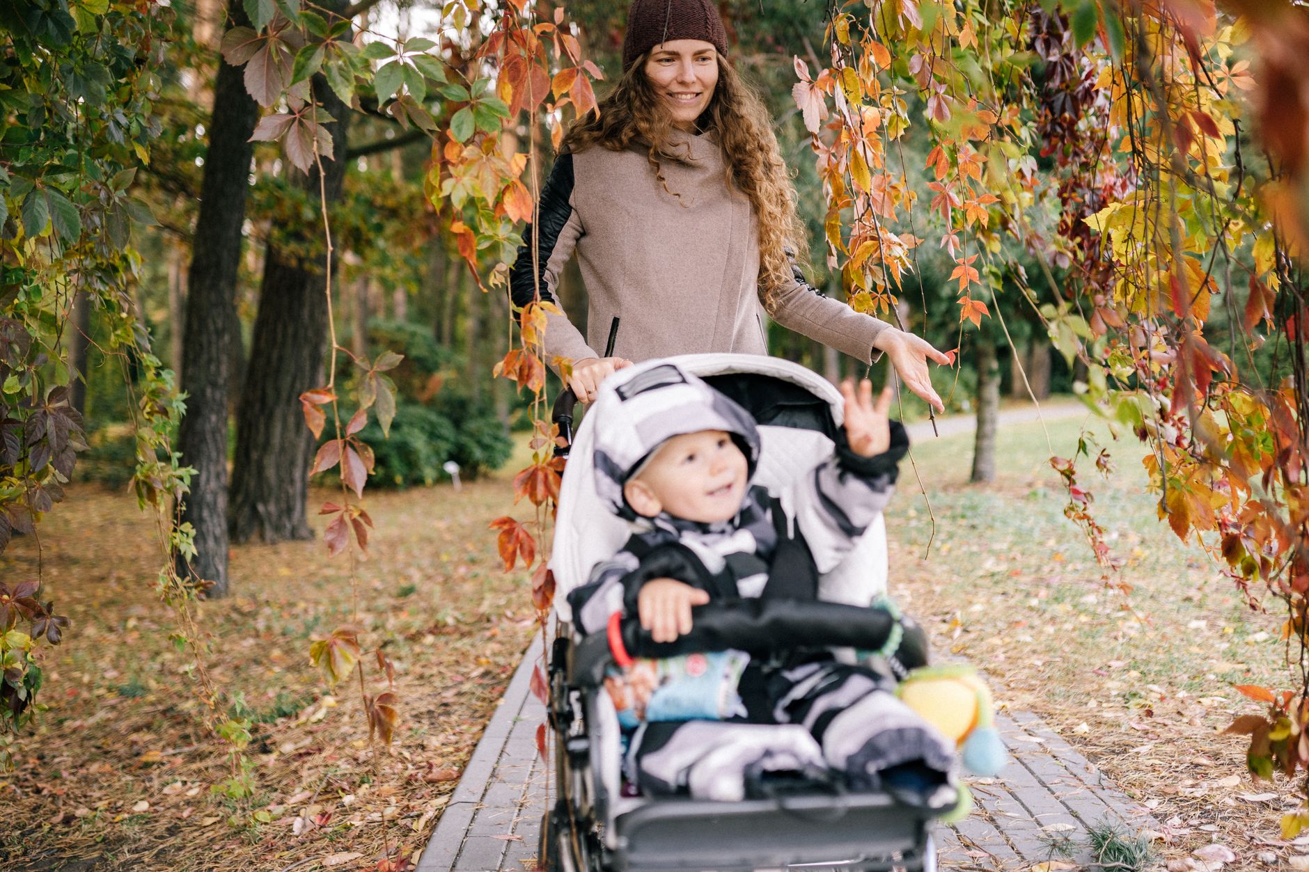Mom checking stroller harness