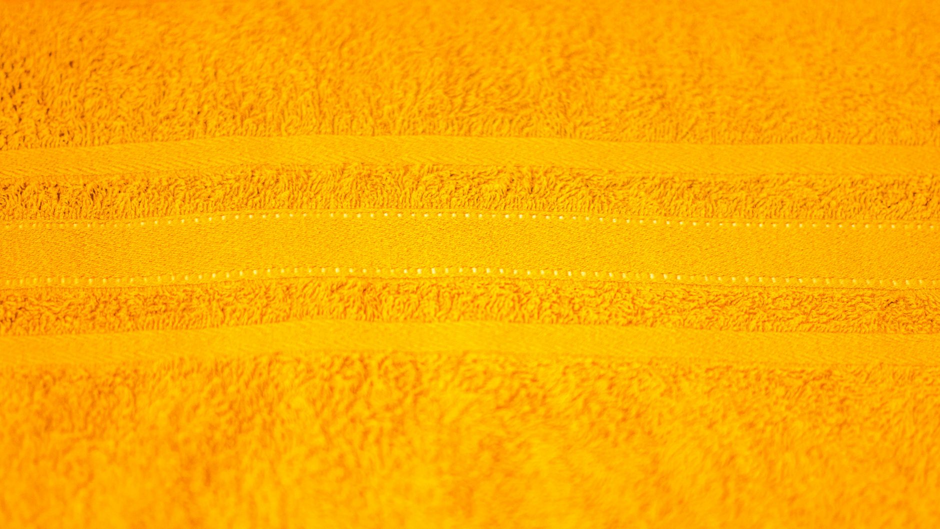 A close‑up of a pelvic‑floor exercise device on a soft linen towel, natural morning light, minimalistic bathroom setting