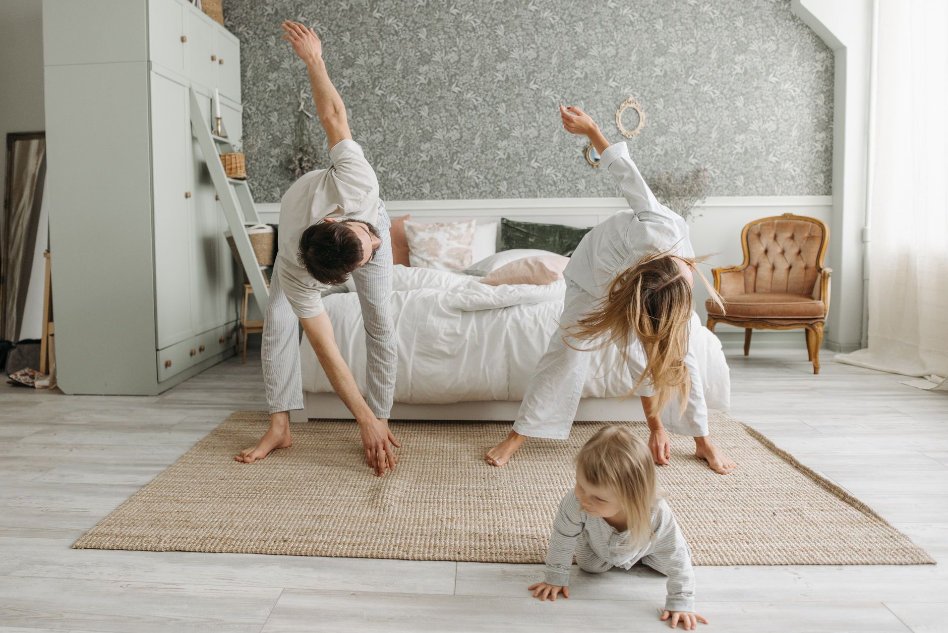 Postpartum mother practicing gentle yoga at home