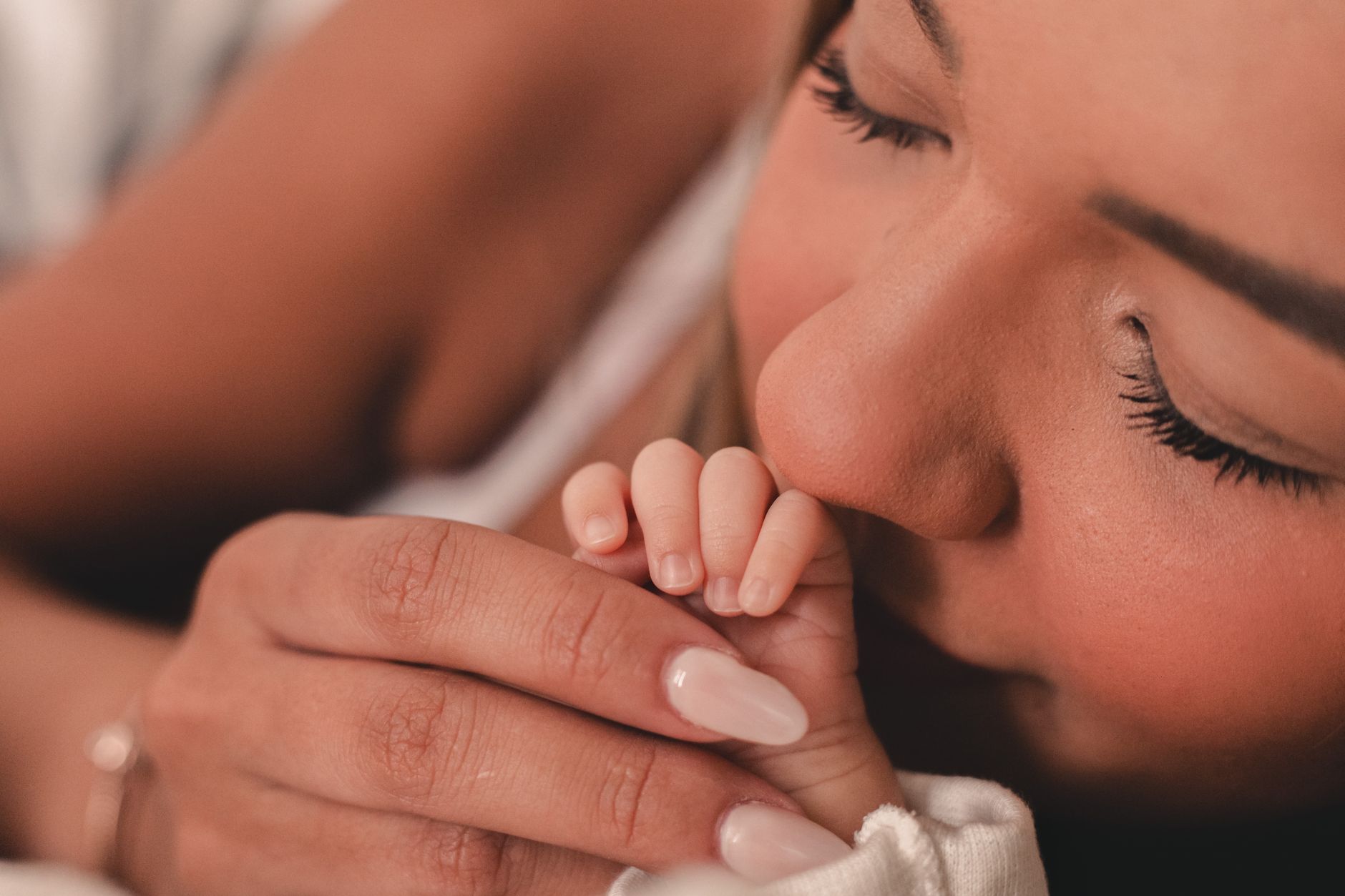 Mother holding baby skin-to-skin