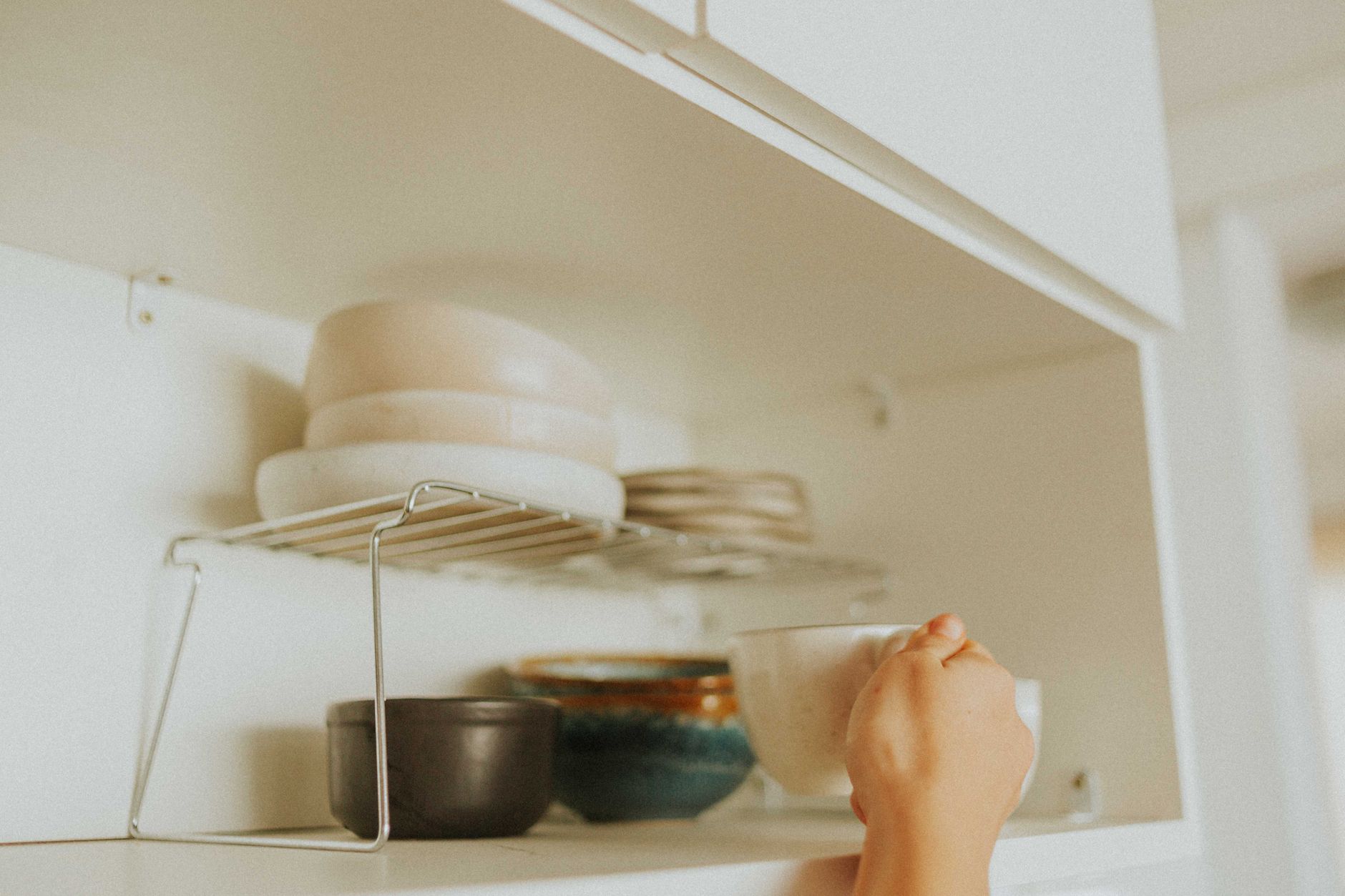 Using a step stool for safe overhead reach in pregnancy