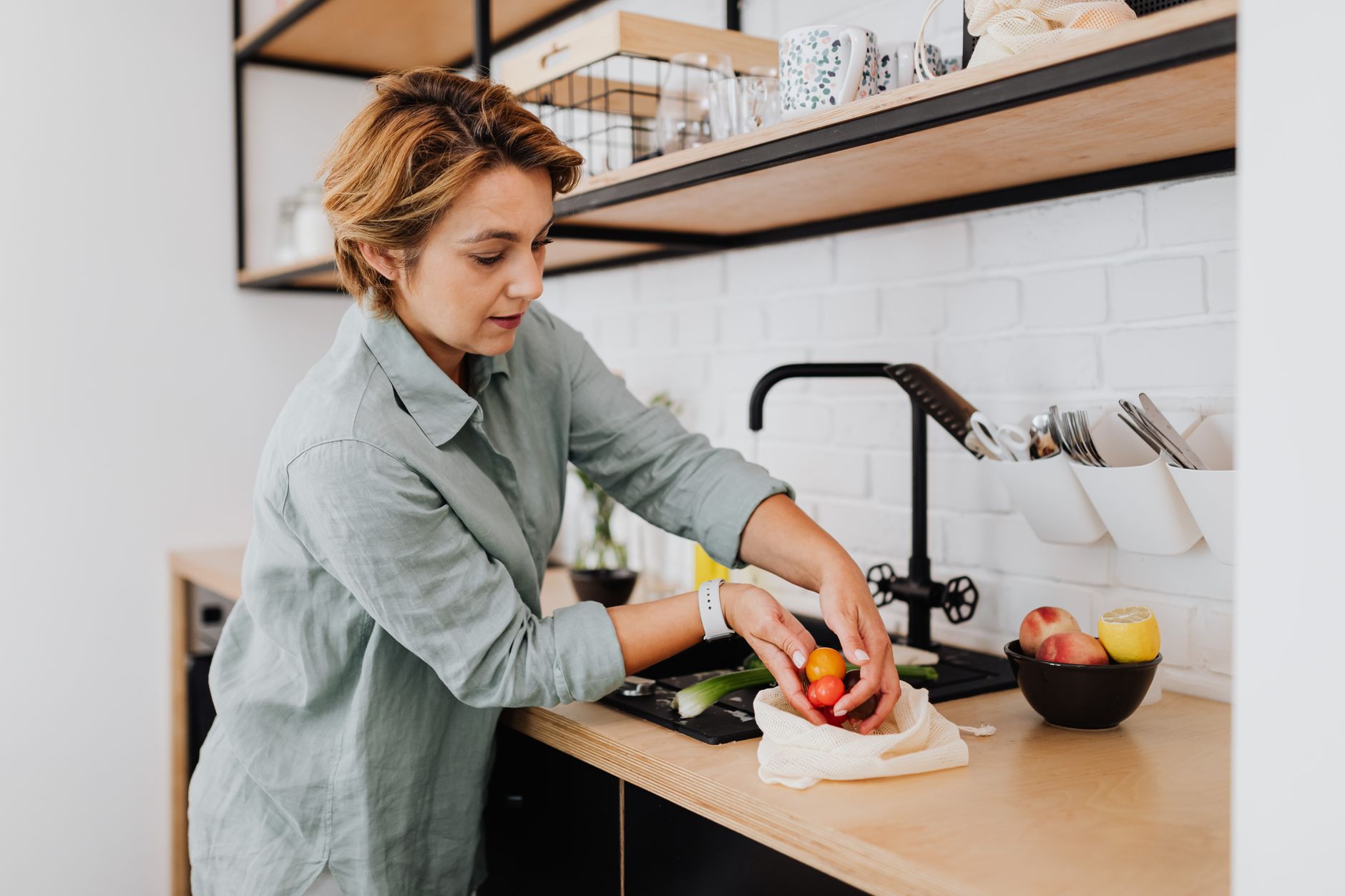 A woman cooking a healthy meal with fresh vegetables