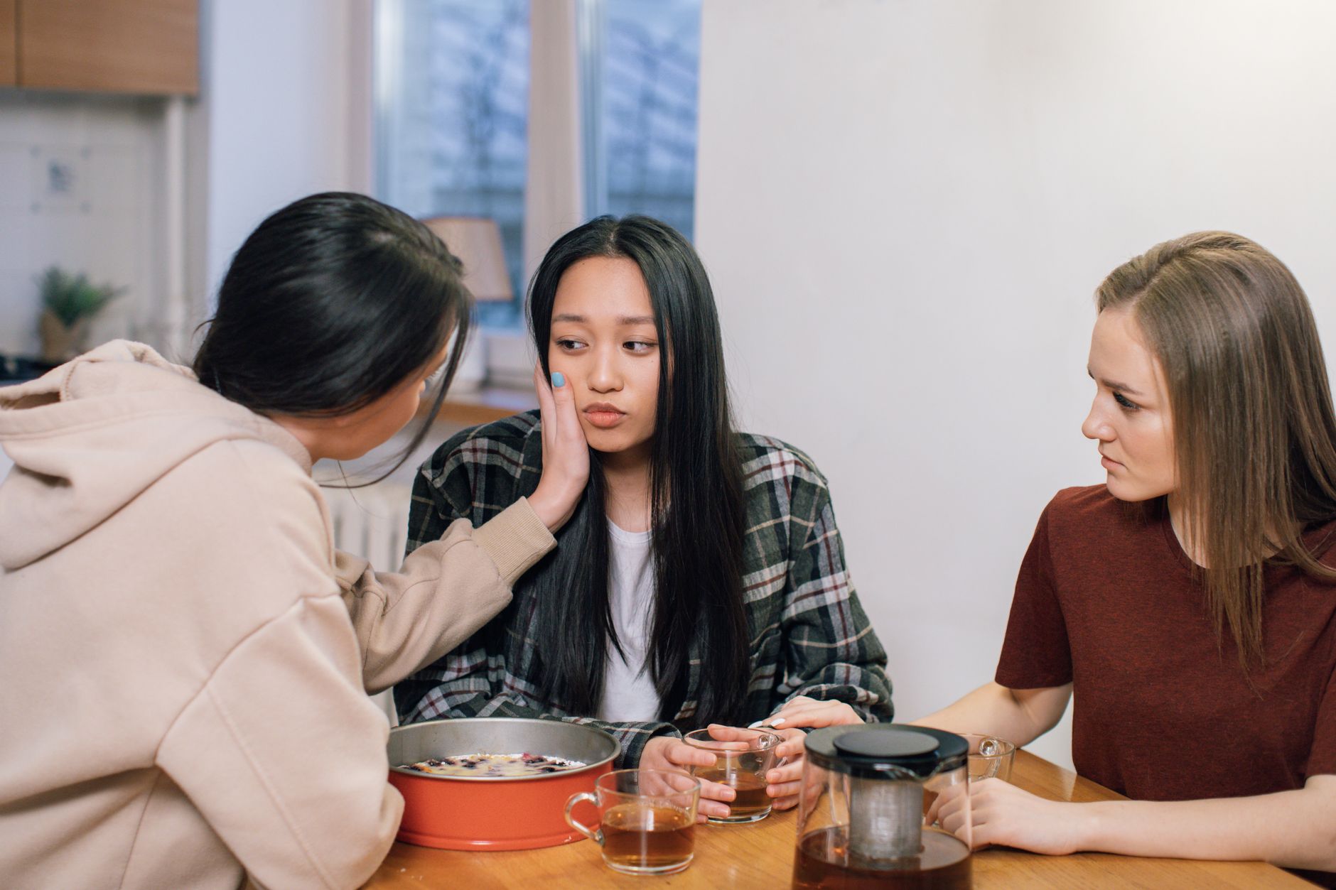 Mothers in a supportive group sharing stories