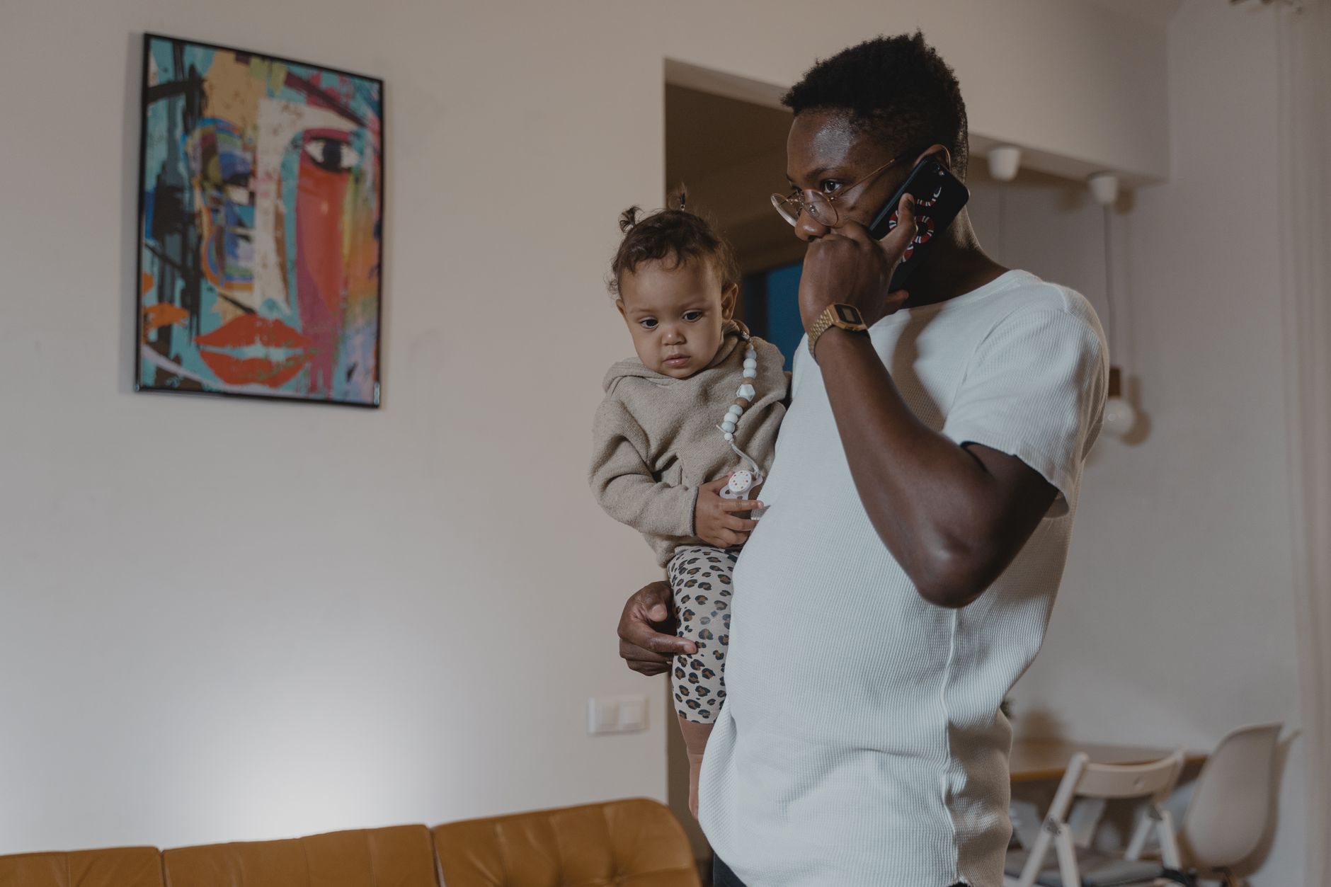 Parent calling pediatrician about baby’s symptoms