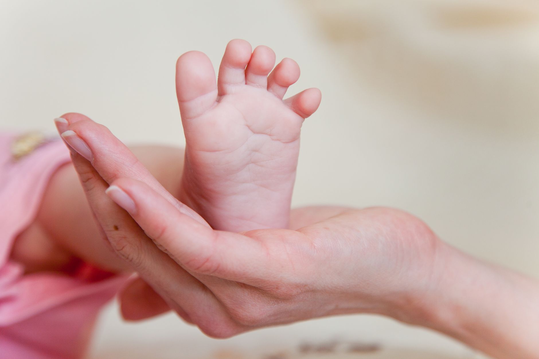 Mother holding baby's foot