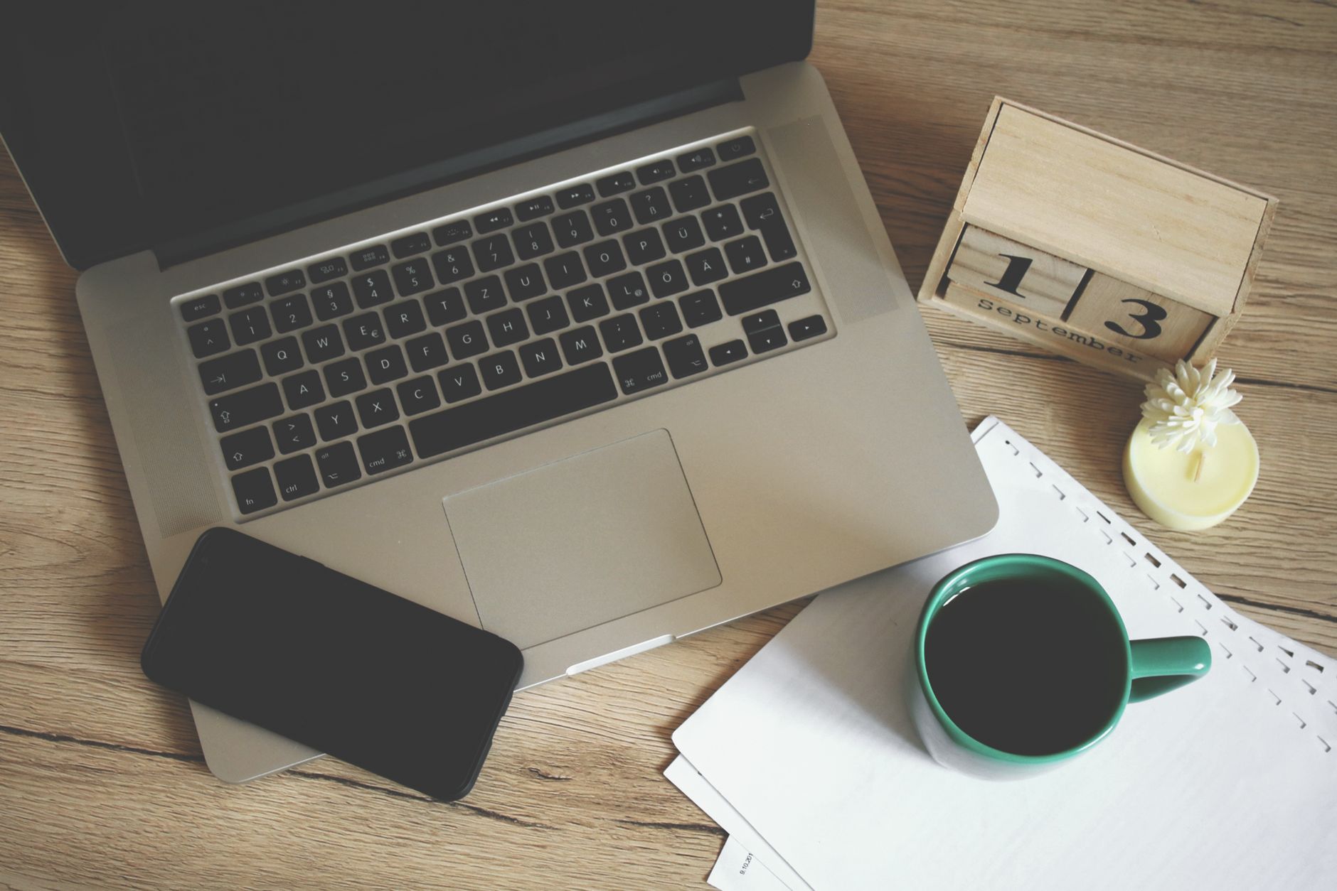 Home office with maternity leave calendar and benefit paperwork.
