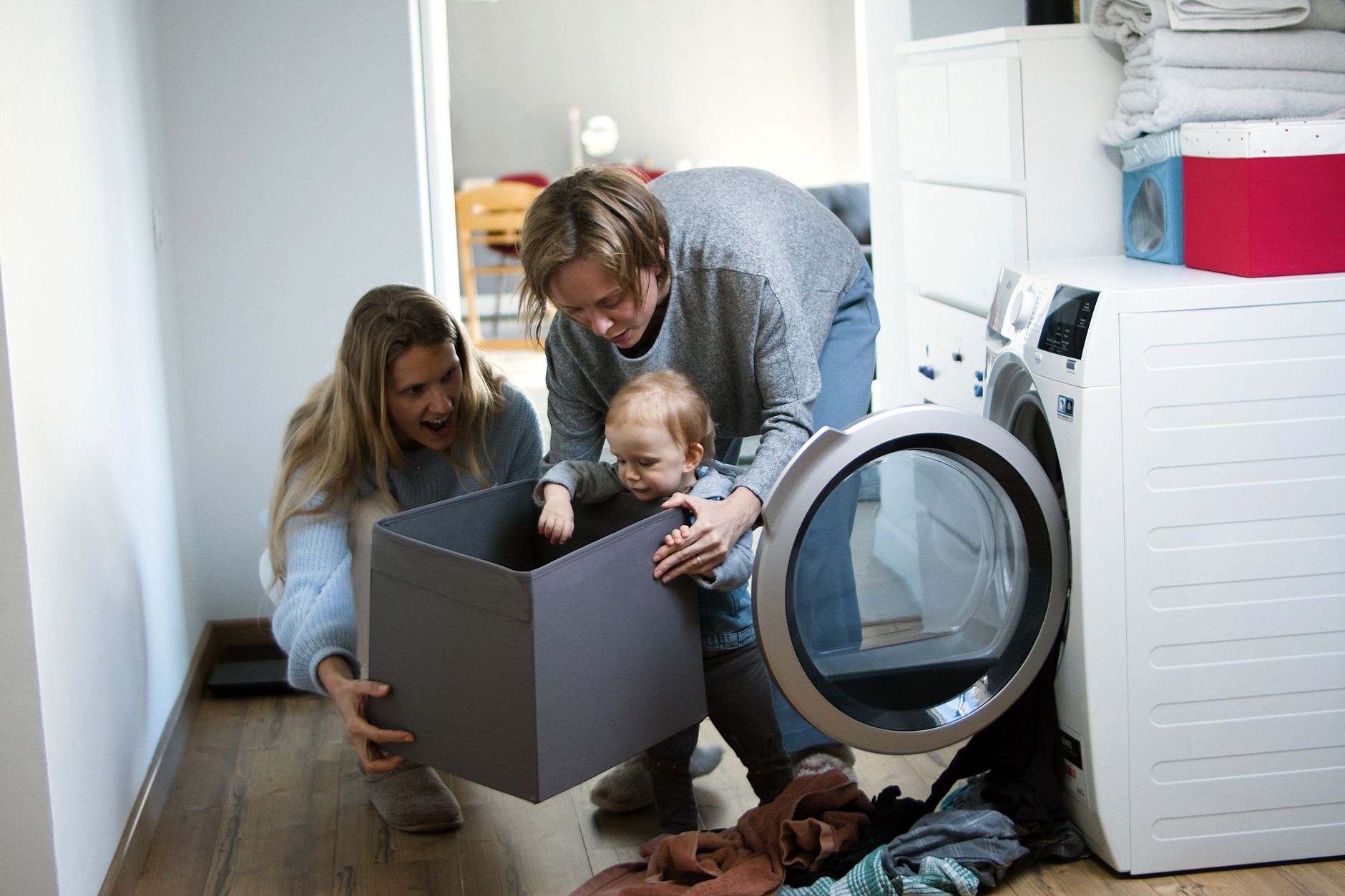 Parent mediating a toddler fight using a sharing basket.