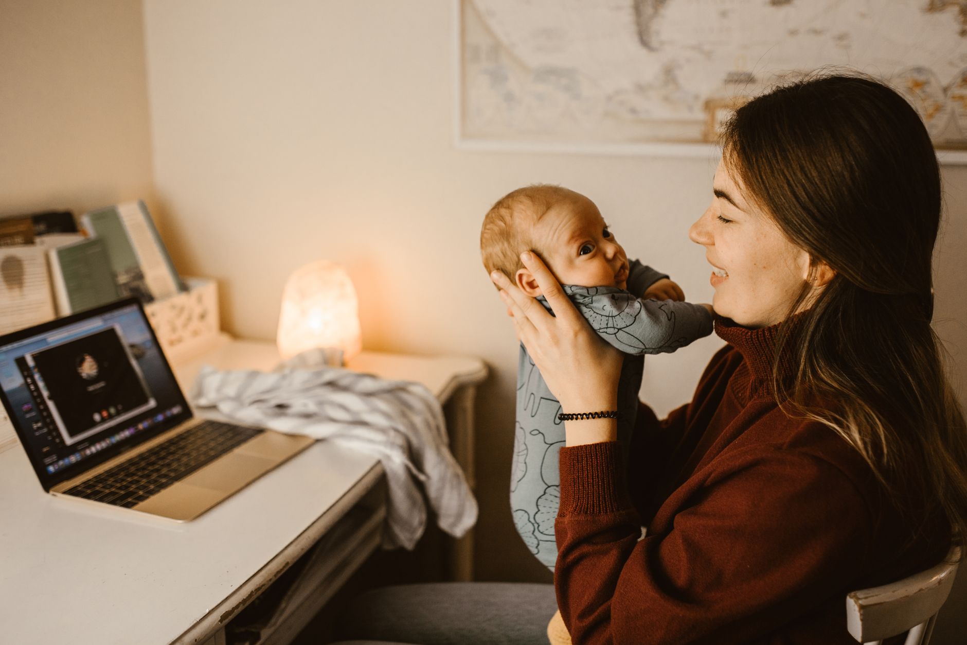 Mom balancing work and childcare at home office