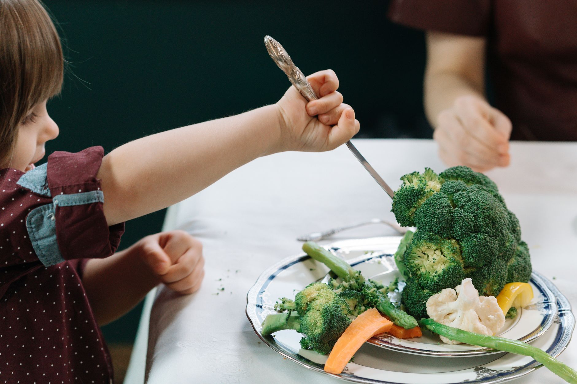 Baby-led weaning plate with soft-cooked veggies