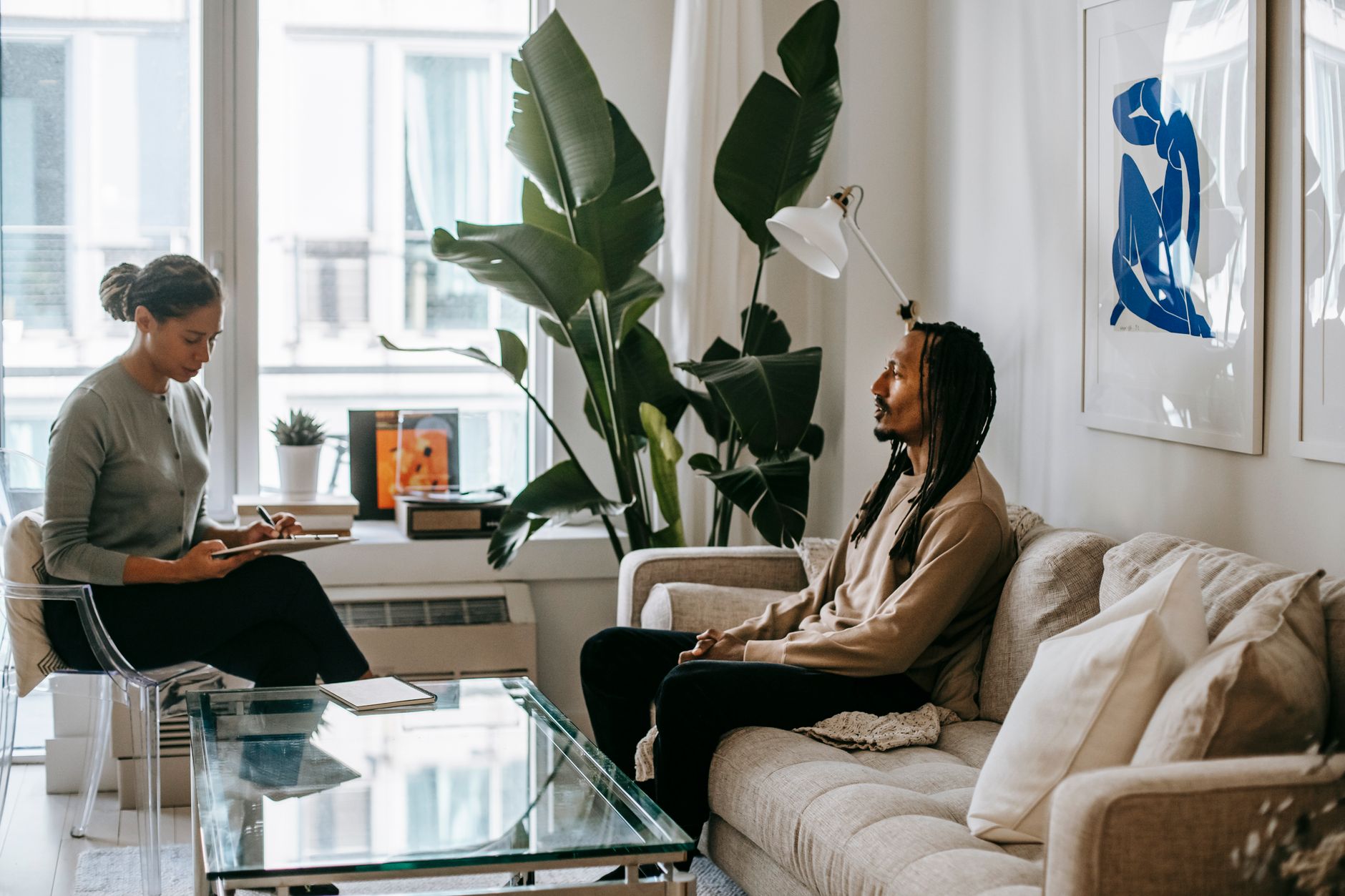 A therapist offering support to a client, symbolizing professional help for anxiety.