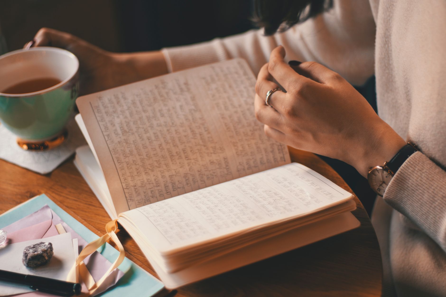 Woman journaling to process emotions.