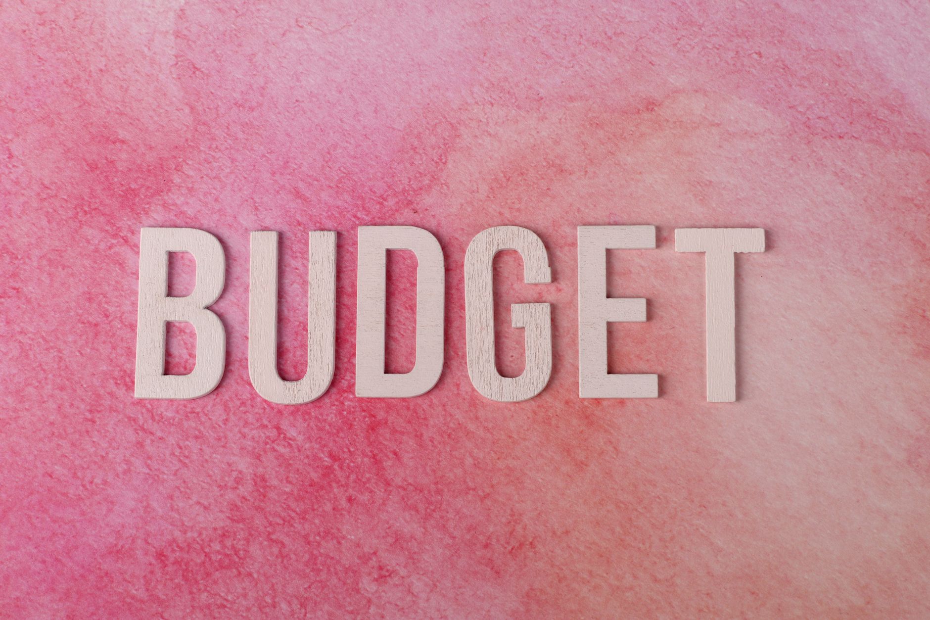 A budget spreadsheet with baby-related expenses listed, showing the financial impact of having a child