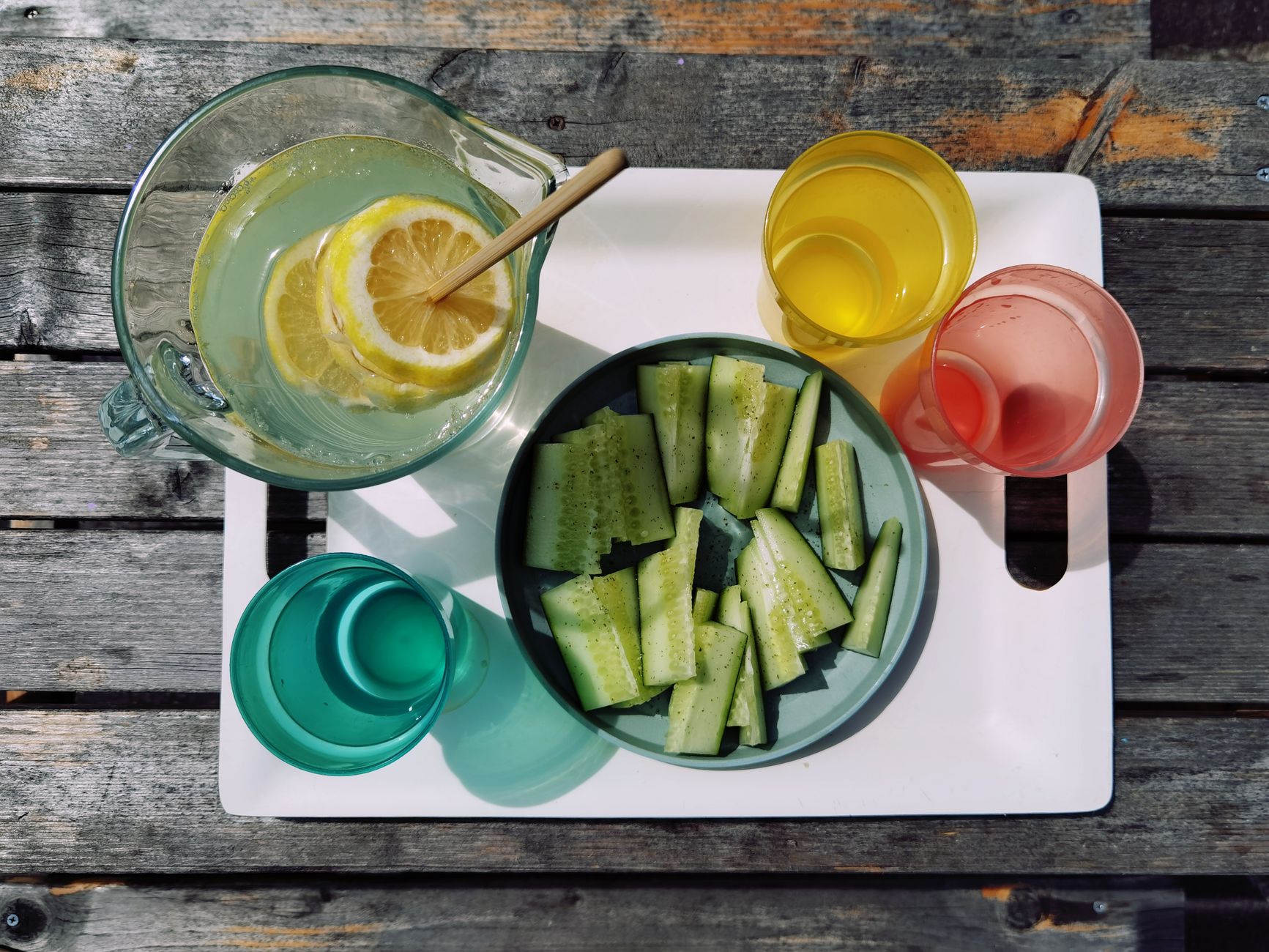 A glass of infused water with lemon slices and cucumber, illustrating hydration tips for pregnant women in their third trimester