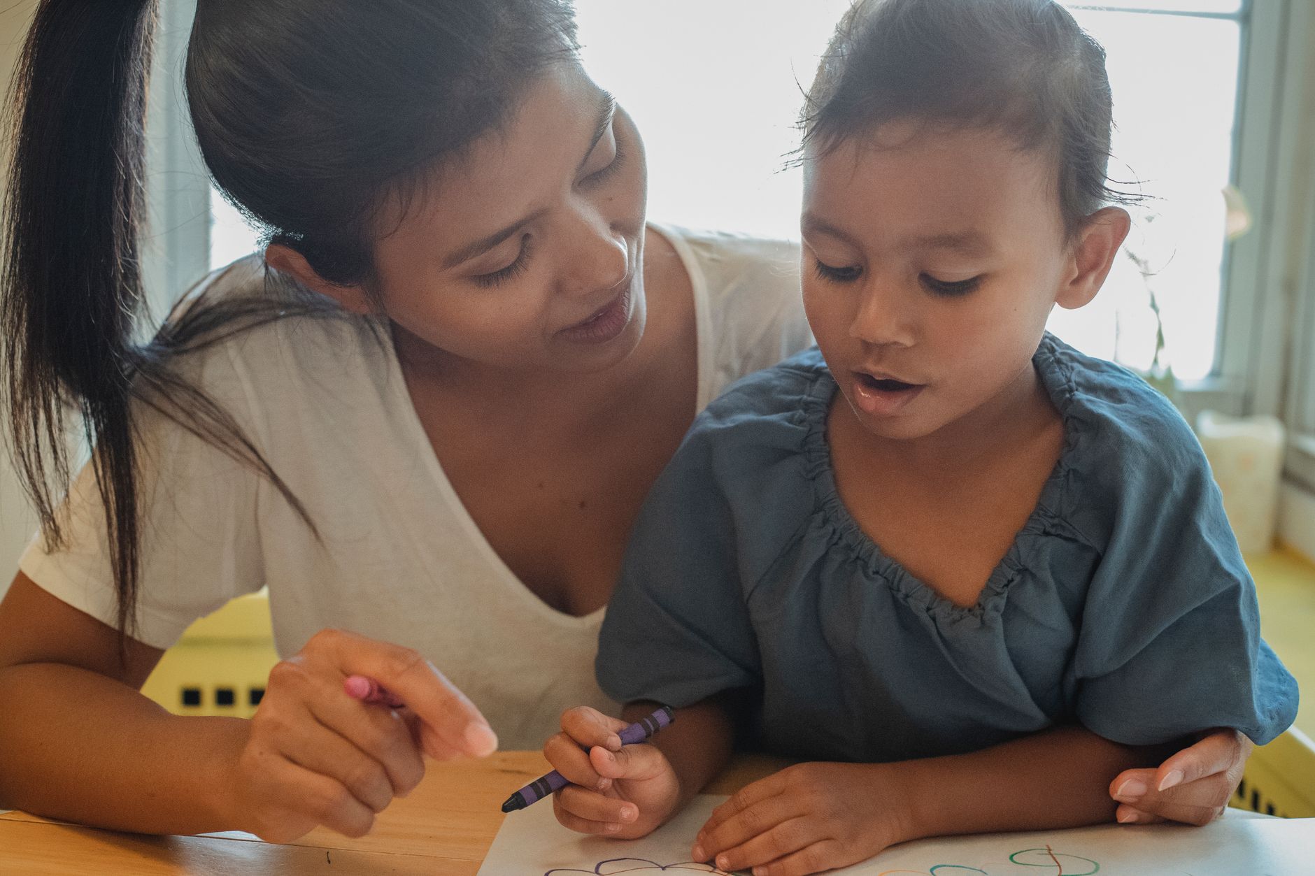 Parent and toddler engaging in positive play