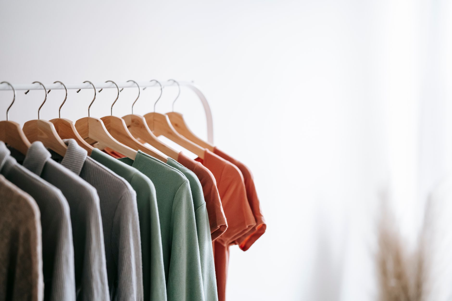 Organized closet with postpartum clothing