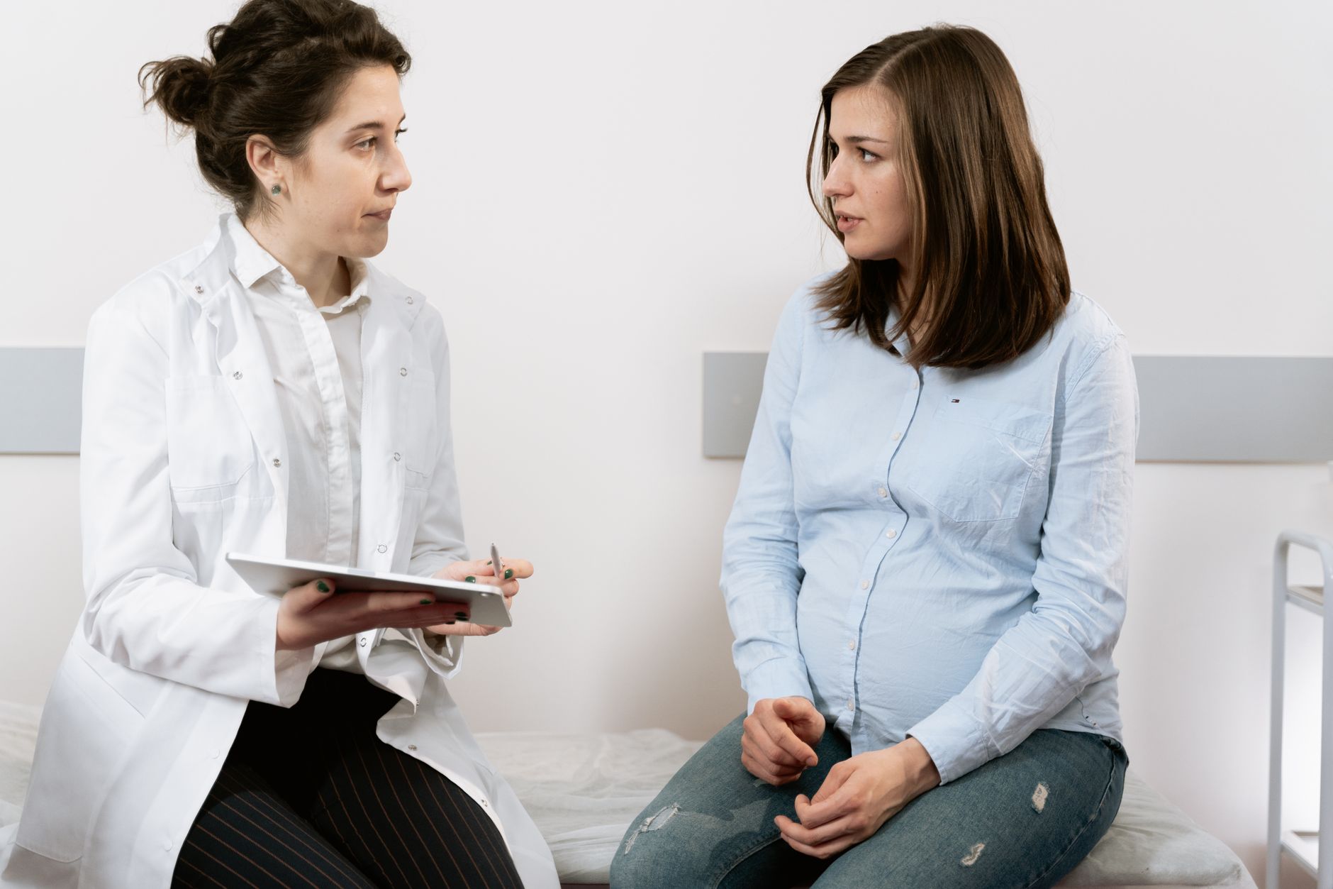 OB‑GYN discussing breast pump coverage with patient