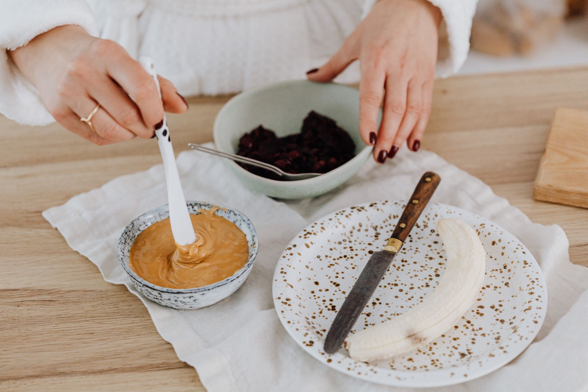 Thinned peanut butter ready for infant feeding