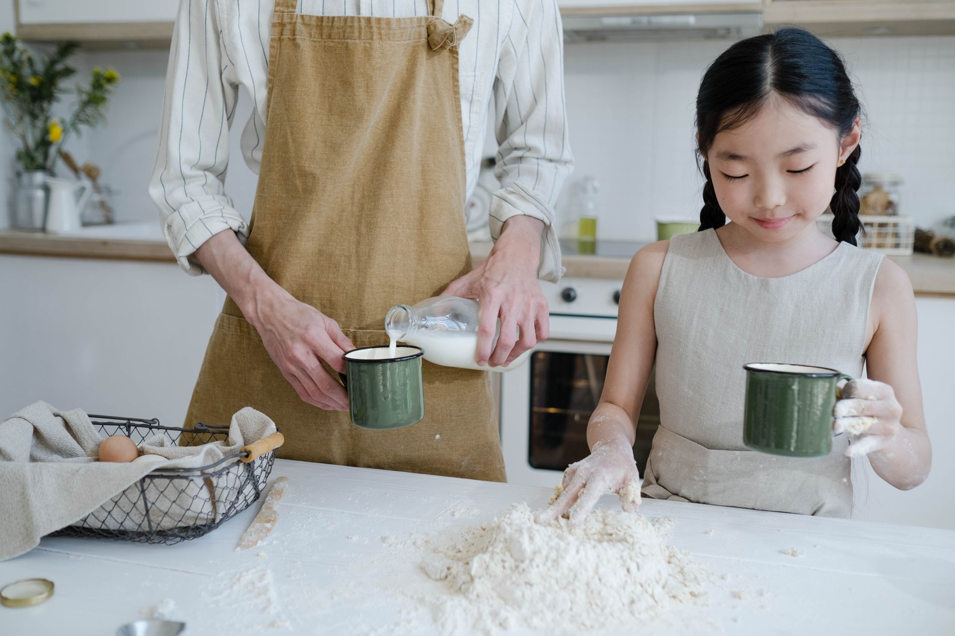 Parent pouring whole milk