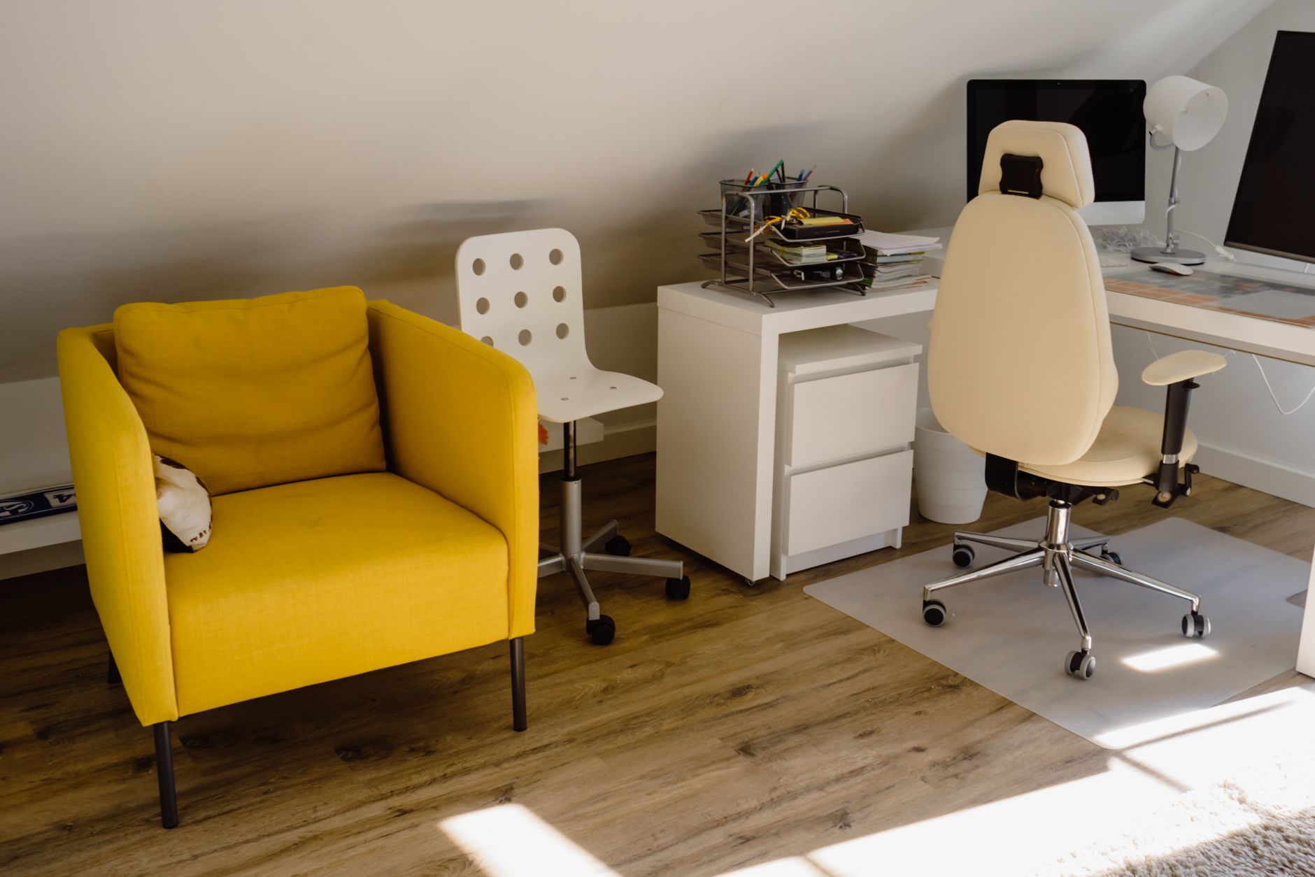 Ergonomic chair and baby bassinet in a shared workspace