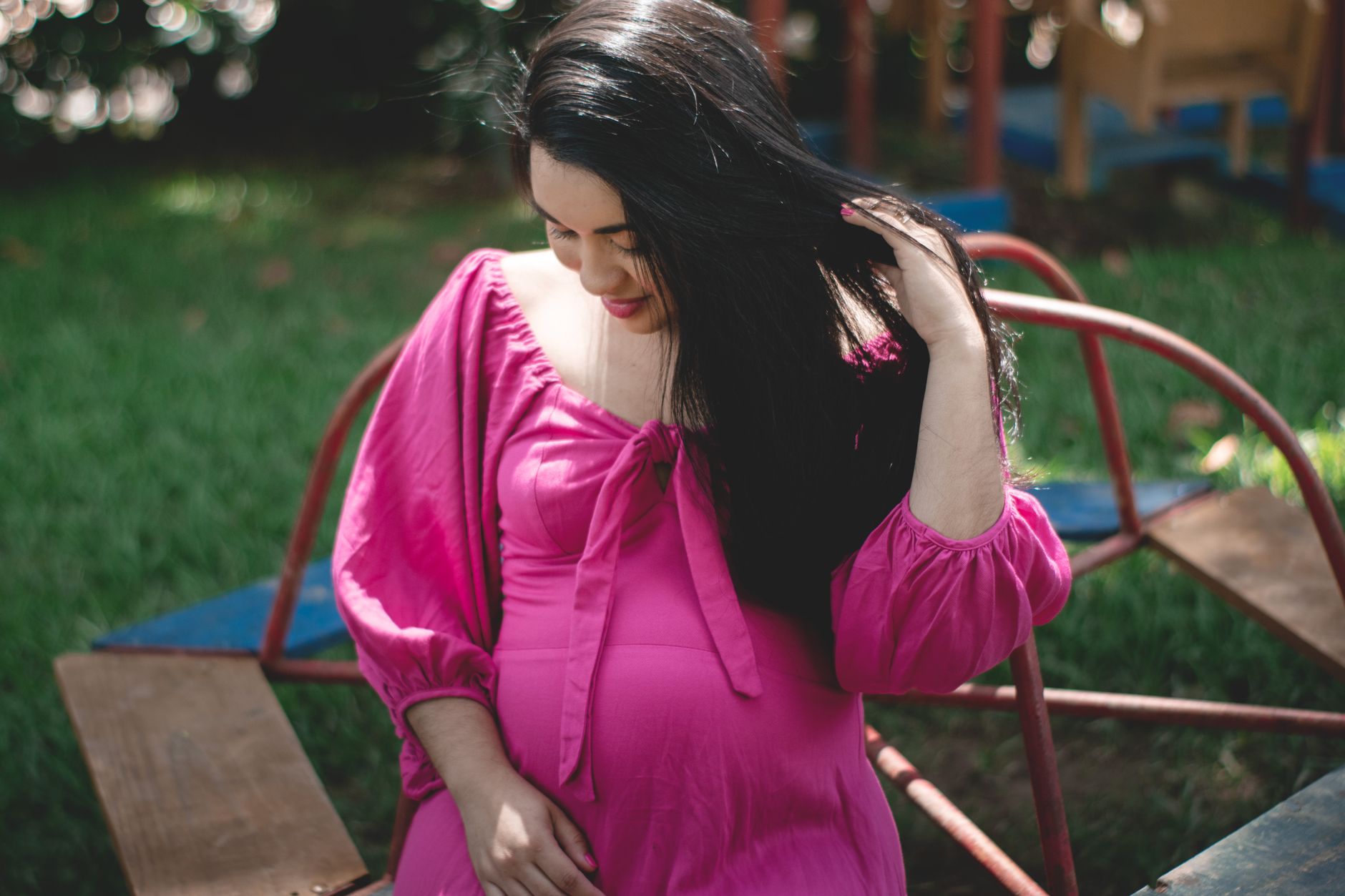Pregnant woman practicing gentle yoga for digestion.
