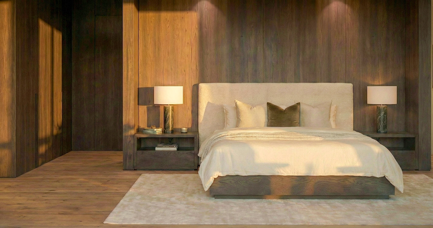 Symmetrical view of a master bed with a beige upholstered headboard. The wall behind is clad in floor-to-ceiling dark timber panelling with integrated warm lighting.