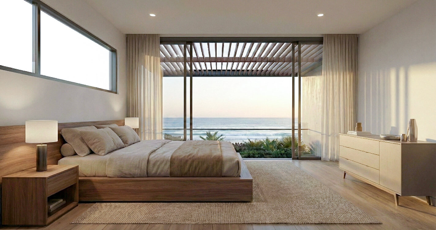 Master bedroom suite overlooking the Pacific Ocean, featuring floor-to-ceiling sliding glass doors and an external timber pergola for passive solar control and shade.