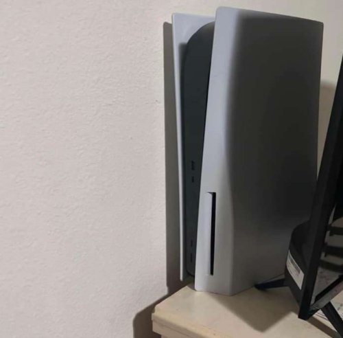 Good condition Sony PS5, white in color, with the controllers