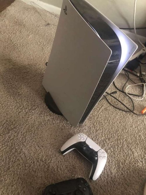 Good condition Sony PS5, white in color, with the controllers