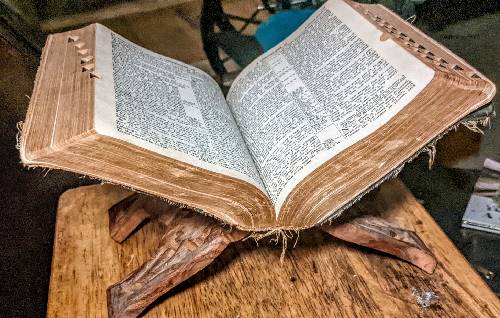 This exquisite antique wooden book/Bible stand is a remarkable piece