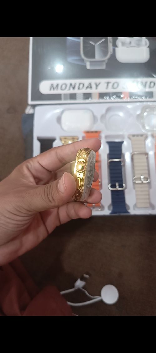 Golden Smart watch with seven straps and earbuds