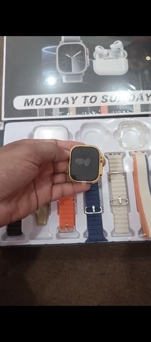 Golden Smart watch with seven straps and earbuds