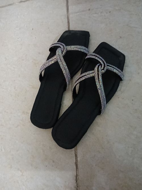 This is a black colour slippers
