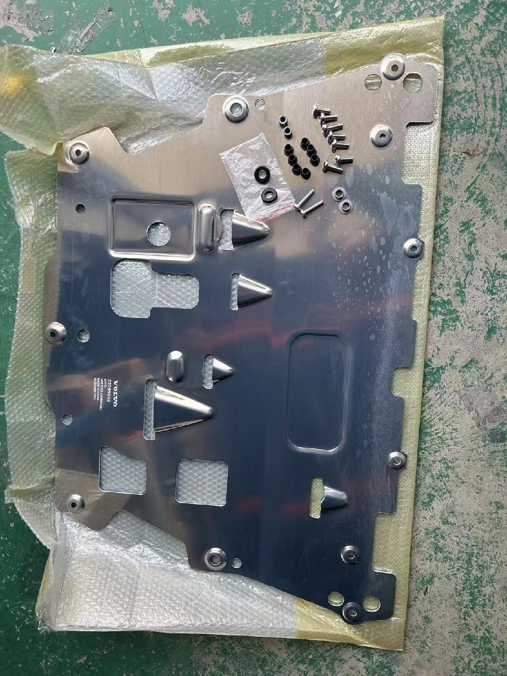 Volvo engine lower guard plate made of titanium alloy with
