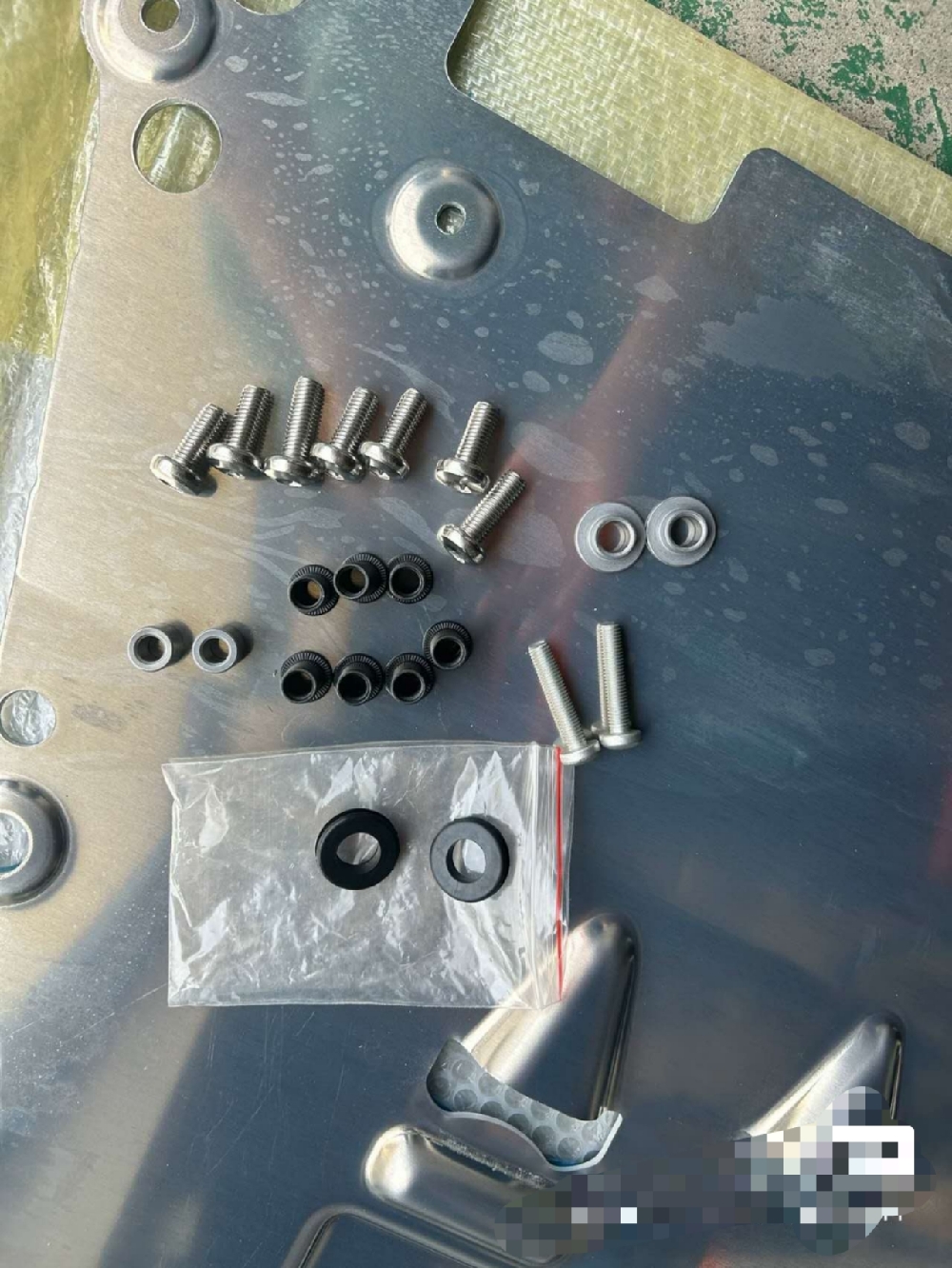 Volvo engine lower guard plate made of titanium alloy with