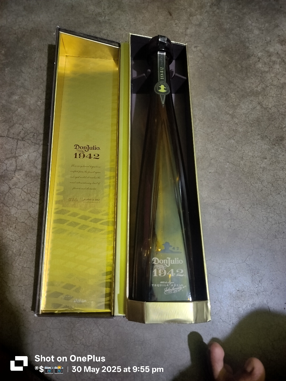 Empty donjulio 1942 bottle with box