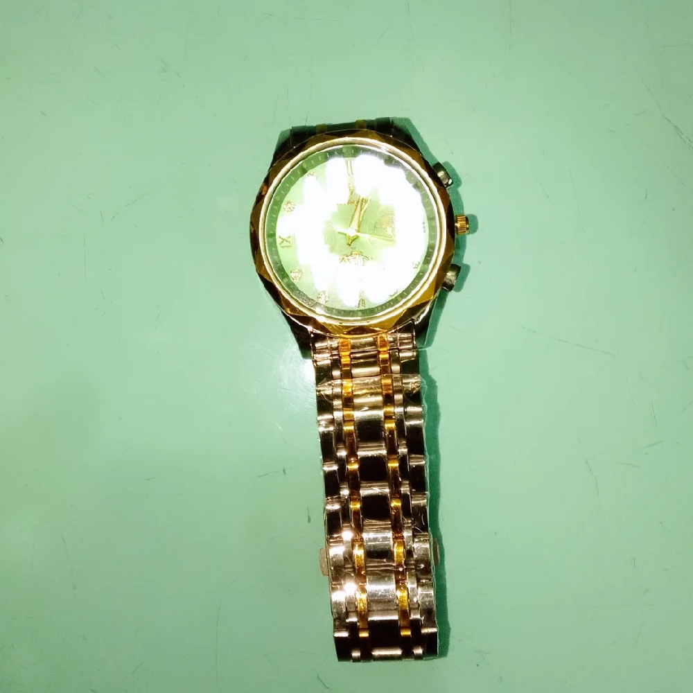 Watch name : POEDAGAR. Colour : golden and white. Quality