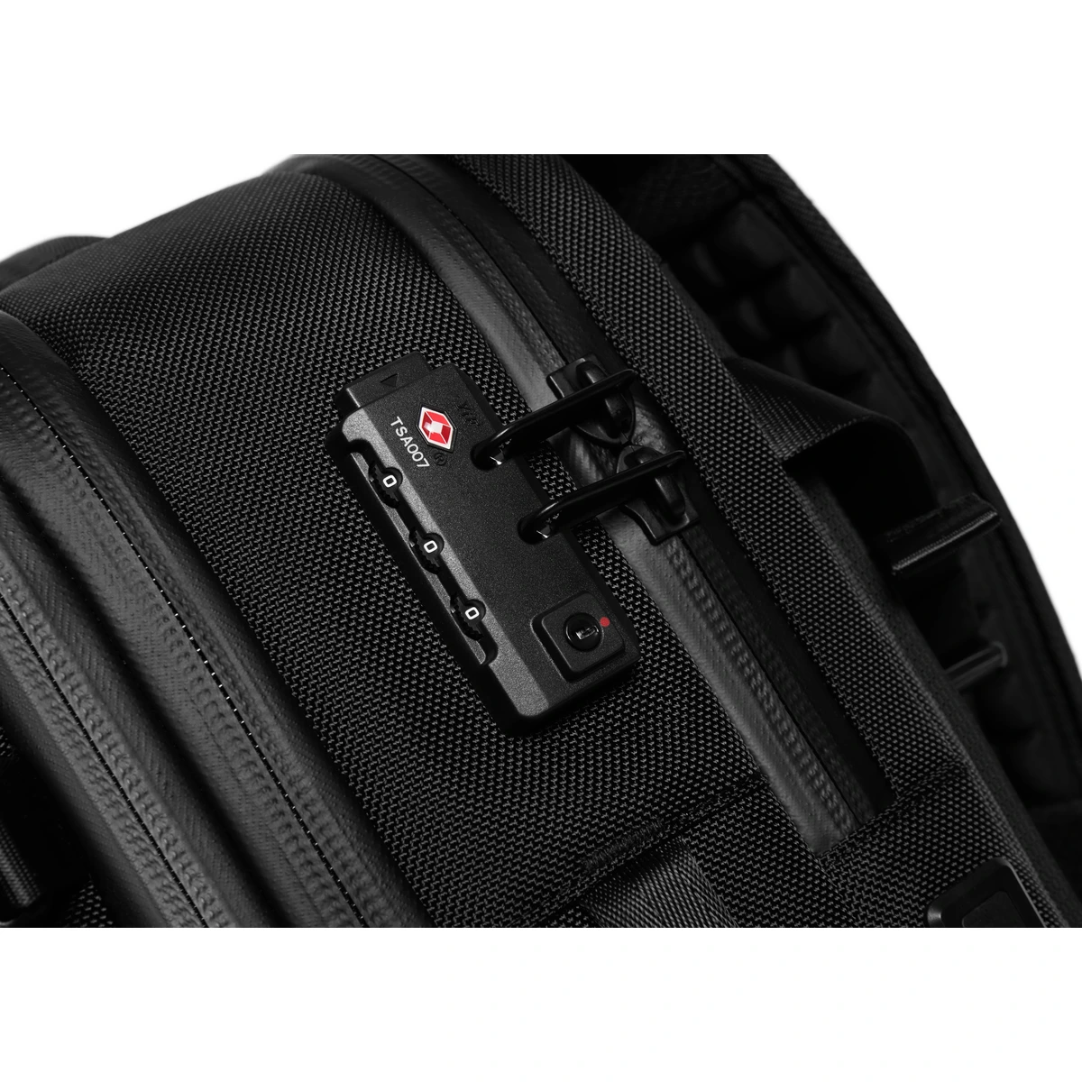 Macro detail of the integrated TSA-approved combination lock securing the main zipper pulls