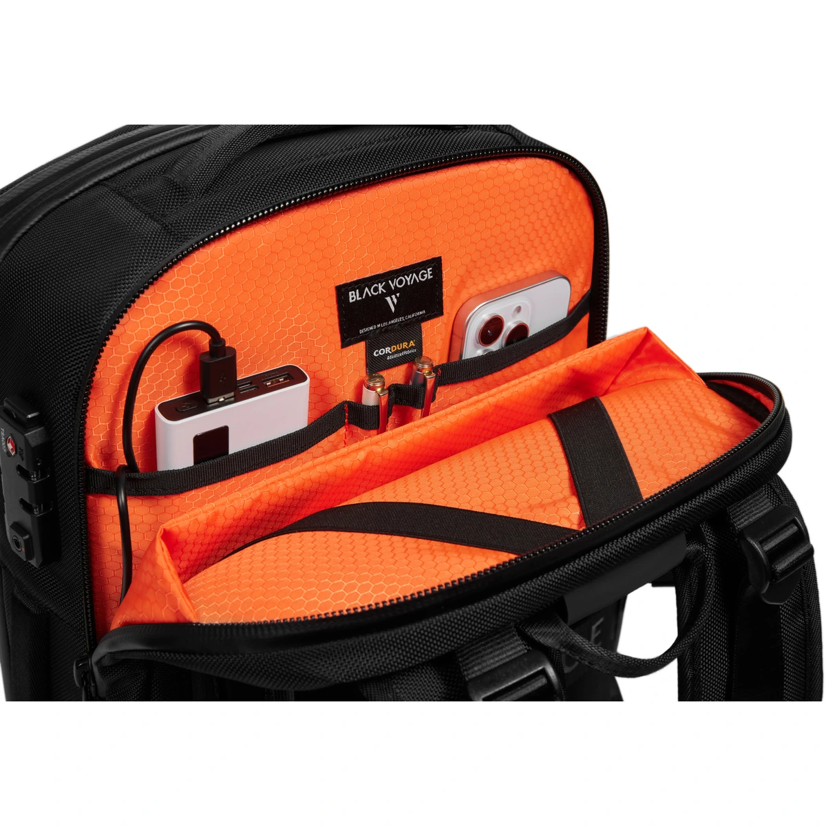 High-visibility orange-lined tech pocket with power bank and phone