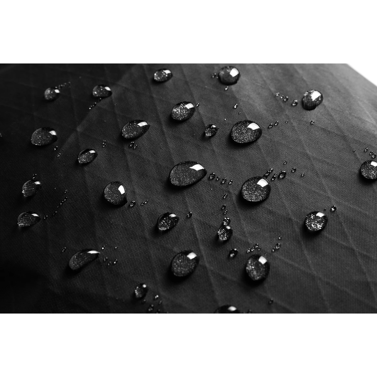 Water droplets beading on the black X-Pac ripstop fabric