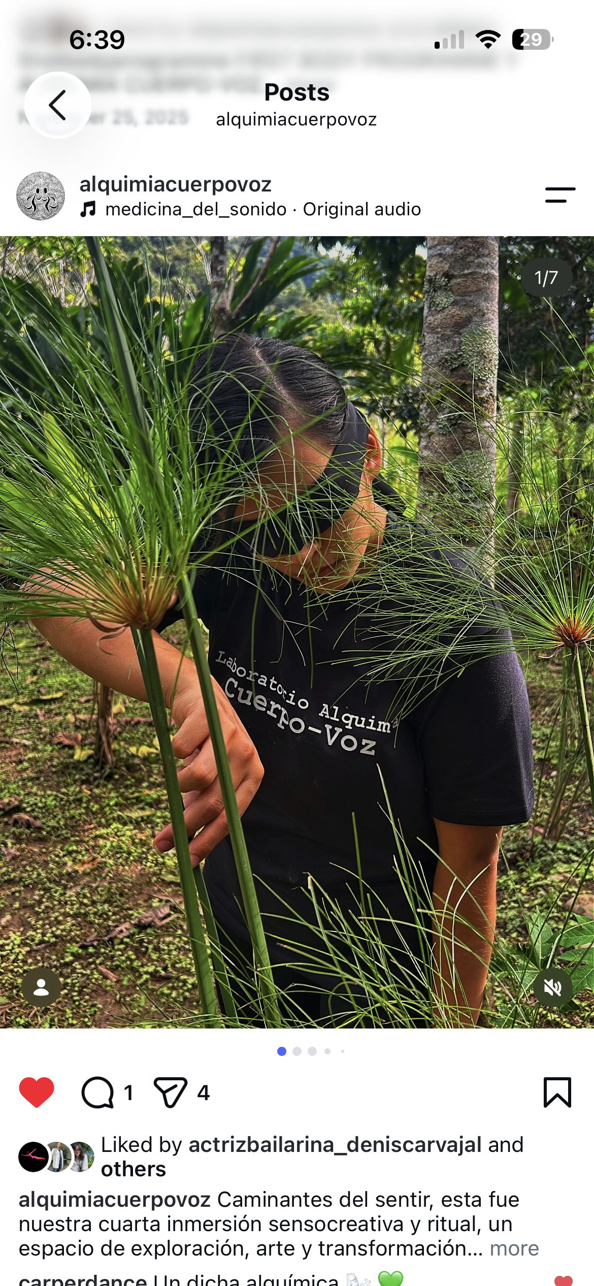 a woman holding a plant with her eyes covered.