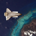 Shuttle Discovery flies backward over Caribbean island. on Twitpic