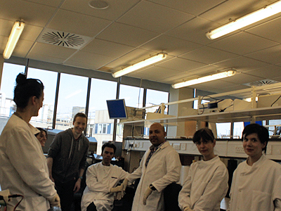 How do artistic practices using biological materials negotiate a scientific knowledge space and develop forms of represe