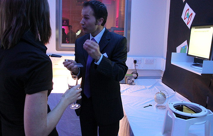 Scientist, Johannes Riegler, demonstrating how iron oxide nanoparticles can be used to steer cells to sites of injury us