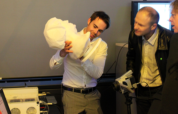 Scientist demonstrating imaging techniques. 
