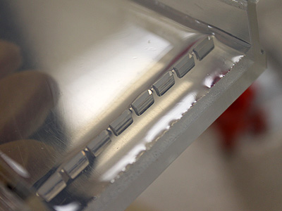After the Agarose liquid becomes gel, the comb is removed forming a set of wells in the gel where the DNA samples and la