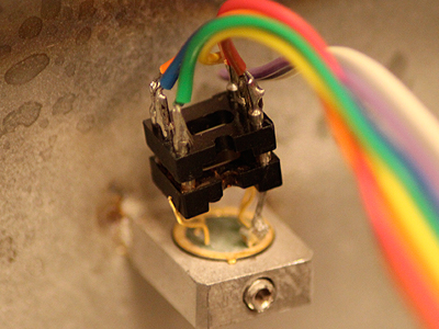 The temperature and humidity sensor is located inside the chamber and connects to the computer via a long wire and a ser